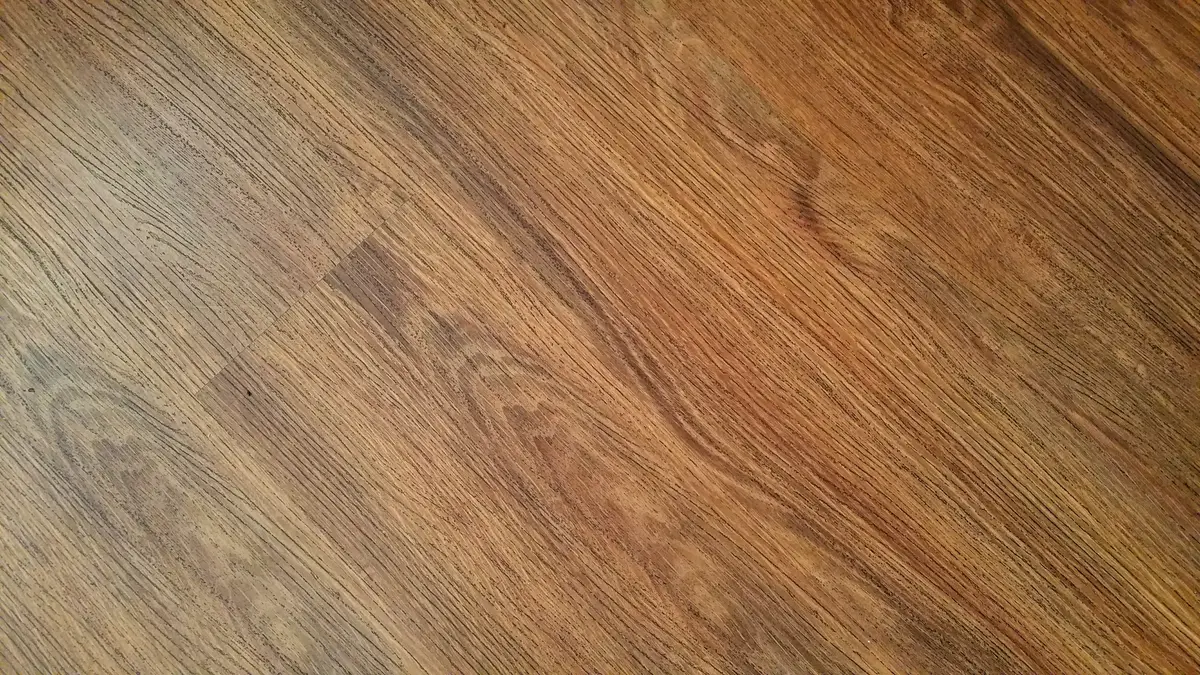 Close-up of luxury vinyl plank LVP flooring showing the wood grain texture and plank seams